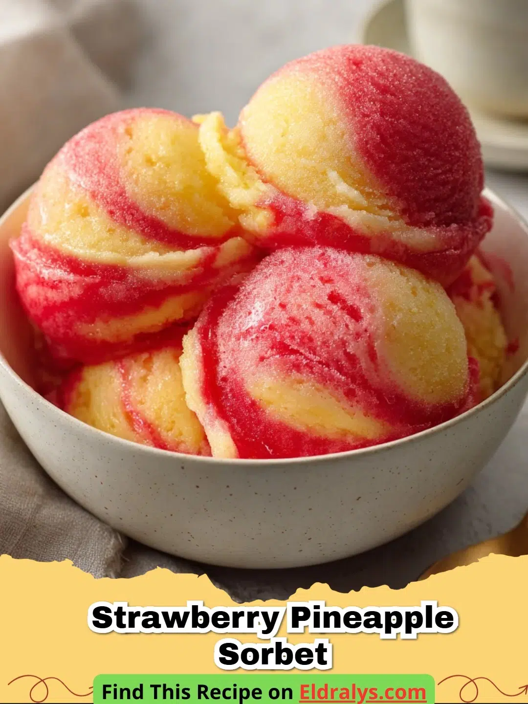 A scoop of vibrant pink Strawberry Pineapple Sorbet in a glass bowl