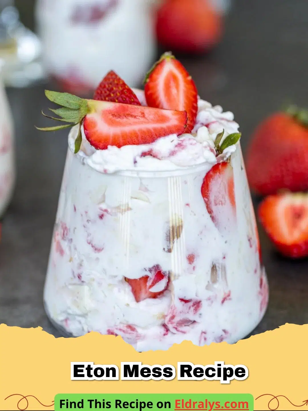 A close-up shot of a traditional Eton Mess Recipe in a glass dish with strawberries and cream.